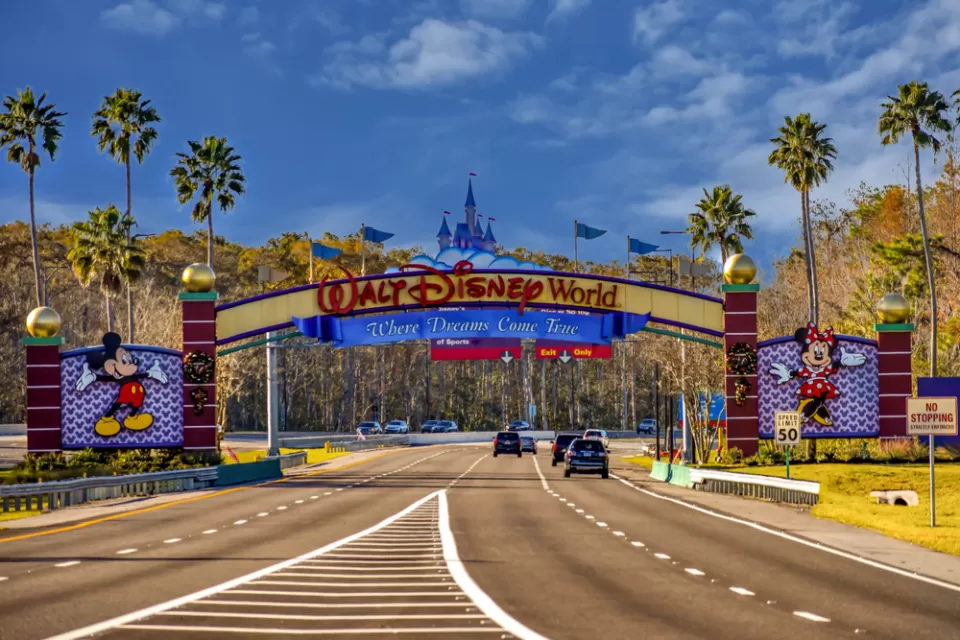 A view of the entrance to Walt Disney World reads “Where Dreams Come True.”